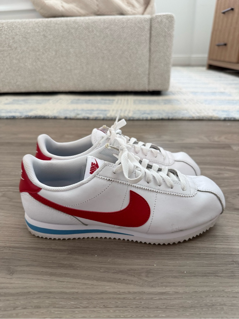 Nike White Sneakers with Red Swoosh and Light Blue Sole Stripe